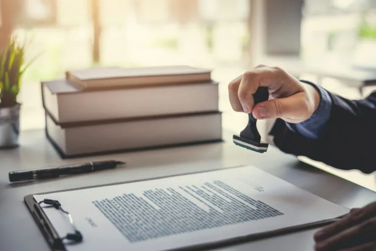 Person stamping a legal document